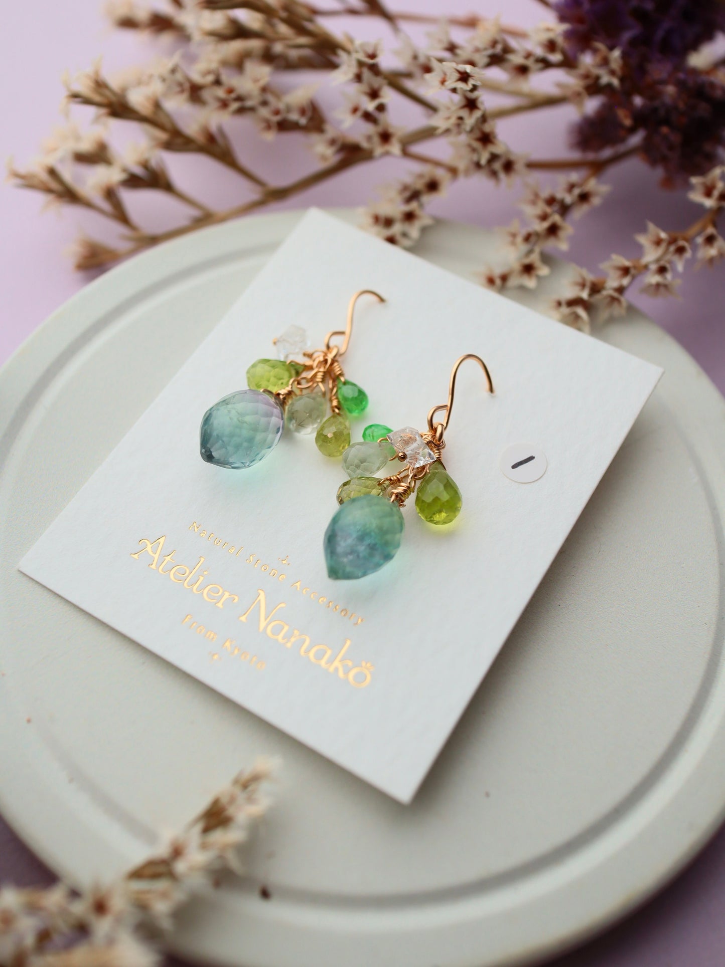 ① Fluorite and yellow-green stone earrings