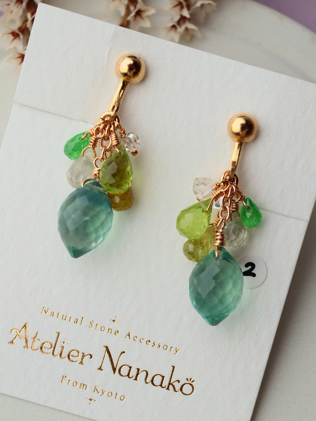 ② Fluorite and yellow-green stone earrings